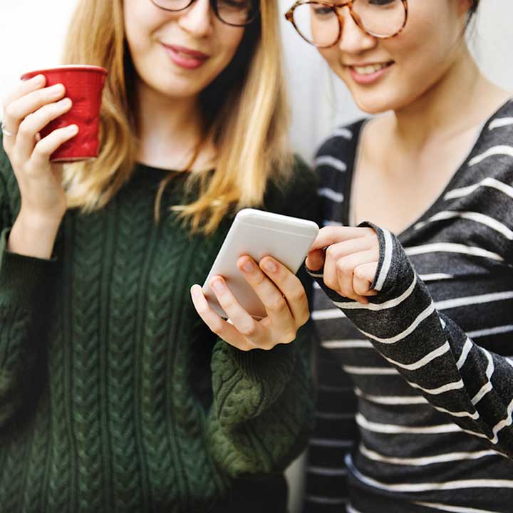 Two girls with smartphone
